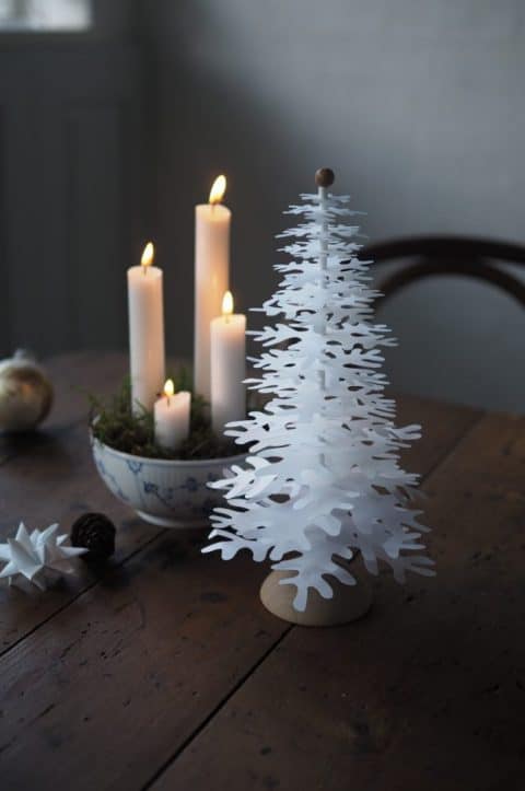Advent decoration with four candles and paper art decorations Christmas trees