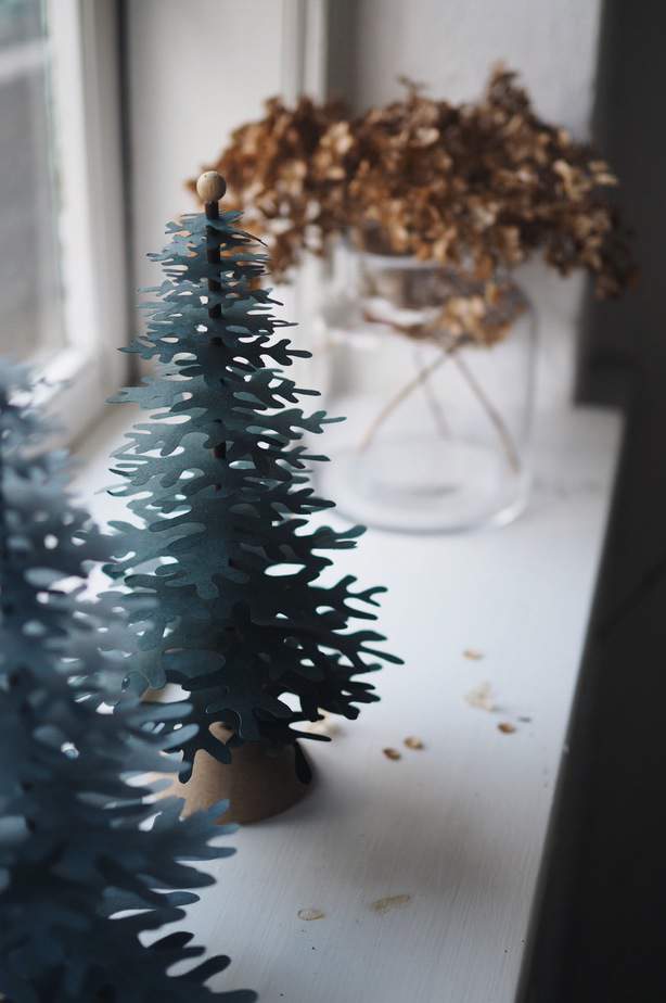 Christmas tree paper ornaments to decorate holiday window elegant and natural